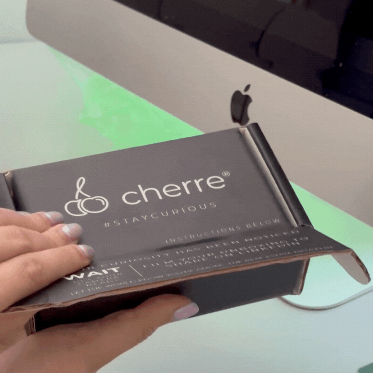 Cherre PR Box being opened, pink butterfly flies out to reveal a pink and gold queen playing card